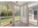 Sunroom with white curtains and views of the backyard at 18840 Silver Quay Dr # 12, Cornelius, NC 28031