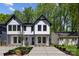 A modern two-story home boasting clean lines, neutral colors, large windows, and professional landscaping at 2004 St John St, Charlotte, NC 28216