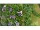 Beautiful aerial view of a luxury home featuring a pool and an outdoor living area surrounded by lush greenery at 2006 Sandy Pond Ln, Waxhaw, NC 28173