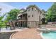 Well-appointed backyard with a patio, a hot tub, and a multi-level deck at 2006 Sandy Pond Ln, Waxhaw, NC 28173