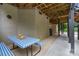 Outdoor covered patio area with a picnic table and grill at 2006 Sandy Pond Ln, Waxhaw, NC 28173