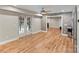 Basement living area featuring brick accent wall and walkout to the patio at 2006 Sandy Pond Ln, Waxhaw, NC 28173