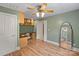 Functional bedroom with hardwood floors, a built-in desk, and shelving for storage at 2006 Sandy Pond Ln, Waxhaw, NC 28173