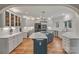Spacious kitchen boasts an island, stainless steel appliances, custom cabinets, and a breakfast area at 2006 Sandy Pond Ln, Waxhaw, NC 28173