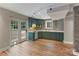 Basement kitchen area with a garden view from the door and window at 2006 Sandy Pond Ln, Waxhaw, NC 28173
