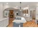 Charming kitchen featuring a gas cooktop island, custom cabinets, and an open flow layout at 2006 Sandy Pond Ln, Waxhaw, NC 28173