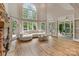 Bright living room features a grand window, hardwood floors, and cozy seating area at 2006 Sandy Pond Ln, Waxhaw, NC 28173