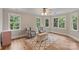 Sitting room featuring hardwood floors, many windows, and comfortable seating near the main bedroom at 2006 Sandy Pond Ln, Waxhaw, NC 28173