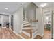 Hardwood staircase leading to the lower level at 2006 Sandy Pond Ln, Waxhaw, NC 28173