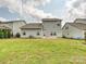 A spacious backyard shows a well maintained lawn area and the rear exterior of the home at 2017 New Hope Branch Way, Belmont, NC 28012