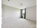 Neutral bedroom with plush carpeting, window, and modern ceiling light at 2017 New Hope Branch Way, Belmont, NC 28012