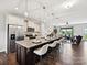 Spacious kitchen with granite countertops, stainless steel appliances, and an island with bar seating at 2017 New Hope Branch Way, Belmont, NC 28012