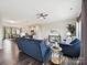 Bright living room with blue sofa, chair, and an open layout connecting to the kitchen and dining area at 2017 New Hope Branch Way, Belmont, NC 28012