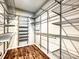 Spacious walk-in closet with custom metal shelving and hardwood floor at 2017 New Hope Branch Way, Belmont, NC 28012