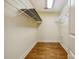Walk-in closet featuring hardwood floors and metal shelving offering plenty of storage space at 2234 Hamilton Mill Rd, Charlotte, NC 28270