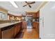 Well-lit kitchen featuring stainless steel appliances and plenty of wood cabinets for ample storage space at 2234 Hamilton Mill Rd, Charlotte, NC 28270