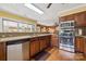 Well-lit kitchen featuring stainless steel appliances and plenty of wood cabinets for ample storage space at 2234 Hamilton Mill Rd, Charlotte, NC 28270