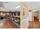 Large open living space, wood floors, and counter seating, creating a welcoming and functional layout at 2234 Hamilton Mill Rd, Charlotte, NC 28270