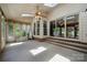 Bright sunroom with ceiling fan, skylights, large windows, sliding glass doors, and comfortable seating at 2234 Hamilton Mill Rd, Charlotte, NC 28270