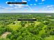 Aerial view of the property, just ~35-40 minute drive to Uptown Charlotte, surrounded by mature trees at 2309 Potter S Rd, Waxhaw, NC 28173
