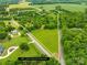 Aerial view of the property showcasing ~21 acres outlined, with a mix of cleared land and surrounding mature trees at 2309 Potter S Rd, Waxhaw, NC 28173