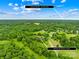 Aerial view highlighting the property's location, just ~9 minutes from Downtown Waxhaw, amid lush greenery at 2309 Potter S Rd, Waxhaw, NC 28173