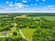 Expansive aerial view featuring a large parcel of land surrounded by farmland and mature trees at 2309 Potter S Rd, Waxhaw, NC 28173