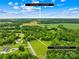 Aerial view showing proximity to downtown Monroe in ~14 minute drive, situated amidst lush greenery at 2309 Potter S Rd, Waxhaw, NC 28173