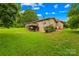 Large brick home with backyard deck overlooking the lawn at 2309 Potter S Rd, Waxhaw, NC 28173