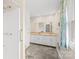 Bright bathroom with double sinks and a shower at 2309 Potter S Rd, Waxhaw, NC 28173