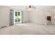 Carpeted bedroom with curtains and a sunny window view at 2309 Potter S Rd, Waxhaw, NC 28173