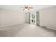 Bright bedroom with neutral carpet, a window, and light walls at 2309 Potter S Rd, Waxhaw, NC 28173