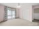 Bedroom with closet, a ceiling fan and a large window at 2309 Potter S Rd, Waxhaw, NC 28173