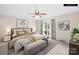 Staged bedroom with a neutral palette and window view at 2309 Potter S Rd, Waxhaw, NC 28173
