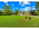 House with attached garage on a large lot with mature trees at 2309 Potter S Rd, Waxhaw, NC 28173