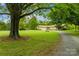 Large mature tree in the front yard shades the house at 2309 Potter S Rd, Waxhaw, NC 28173