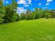Picturesque acreage, cleared and ready for your dream home featuring mature trees and scenic views at 2309 Potter S Rd, Waxhaw, NC 28173
