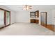 Bright, spacious room featuring built-in shelving, and french doors with natural light at 2309 Potter S Rd, Waxhaw, NC 28173