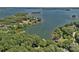 Aerial shot of lakefront homes surrounded by lush greenery and sparkling water at 2563 Brawley School Rd, Mooresville, NC 28117