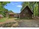 Charming rustic exterior with a small shed and well-maintained grounds at 2563 Brawley School Rd, Mooresville, NC 28117