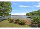 Beautiful waterfront property showcasing serene lake views and lush landscaping at 2563 Brawley School Rd, Mooresville, NC 28117