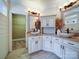 Bathroom featuring double vessel sinks with stone countertops and modern fixtures at 2608 Golden Bell Dr, Gastonia, NC 28056