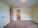 Bedroom featuring a closet and neutral walls leading to additional rooms at 2608 Golden Bell Dr, Gastonia, NC 28056