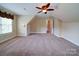 Spacious room with windows, and a ceiling fan for ventilation at 2608 Golden Bell Dr, Gastonia, NC 28056