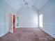 Bedroom with French doors leading to staircase and vaulted ceiling with fan at 2608 Golden Bell Dr, Gastonia, NC 28056
