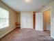 Neutral bedroom with built-in desk, closet, and attached bathroom at 2608 Golden Bell Dr, Gastonia, NC 28056