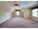 Large bedroom featuring vaulted ceilings and two windows at 2608 Golden Bell Dr, Gastonia, NC 28056
