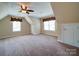 Spacious room with windows, curtains, and a ceiling fan for ventilation at 2608 Golden Bell Dr, Gastonia, NC 28056