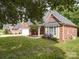 Attractive brick home boasting a well-maintained lawn, attached garage, and mature landscaping at 2608 Golden Bell Dr, Gastonia, NC 28056
