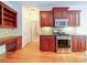 Well-equipped kitchen features a gas range, stainless steel appliances, granite countertops, and wood cabinetry at 2608 Golden Bell Dr, Gastonia, NC 28056